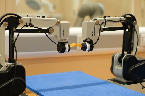 New dual-arm robotic achieves bimanual duties by studying from simulation